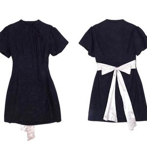 Very cute party dress/ black with bow tie on the back